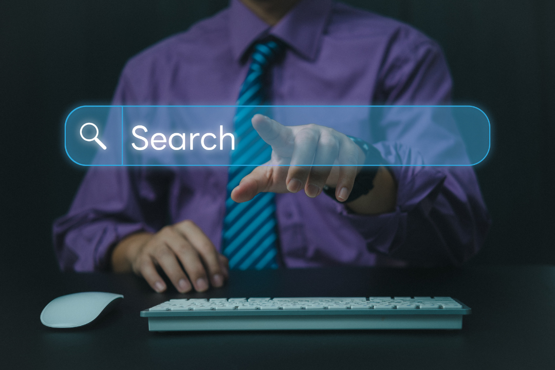 Marketer analyzing user behavior data on a computer screen using Google Search Console reports.